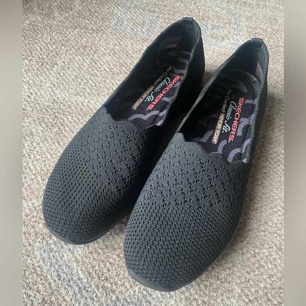 Black Skechers slip on shoes